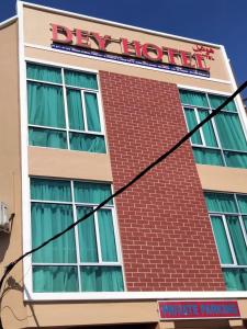 a building with a sign on the side of it at Alia Express Dey Hotel Kota Bharu in Kota Bharu
