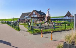 a park with a playground with a slide at Beautiful Apartment In Dagebll With Kitchen in Dagebüll