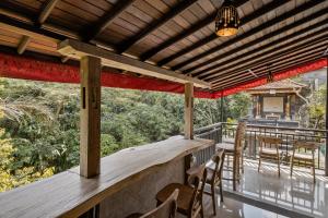 Balkón nebo terasa v ubytování Tigata Ubud Cottage