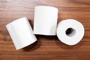 a roll of toilet paper on a wooden table at Meteor Shower in Sapporo