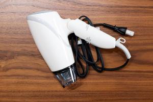 a white hair dryer on a wooden table at Meteor Shower in Sapporo