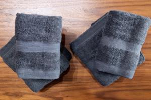 two gray socks sitting on a wooden floor at Meteor Shower in Sapporo