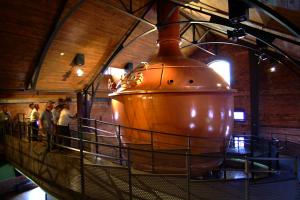 a large copper pot on display in a building at Meteor Shower in Sapporo