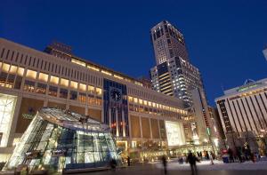 a large building with a clock tower in front of it at Meteor Shower in Sapporo