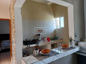 a kitchen with a counter with two plates on it at Nice apartamento. 5 minutos del aeropuerto. in Mexico City