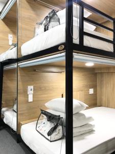 Postel nebo postele na pokoji v ubytování Amango Dorm