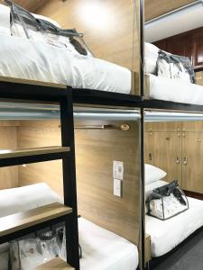 Postel nebo postele na pokoji v ubytování Amango Dorm