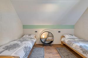 Ένα ή περισσότερα κρεβάτια σε δωμάτιο στο Riverside Resort Stari Malni Kolpa