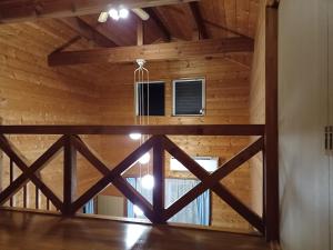 a view of the inside of a log cabin with a window at コテージ　マリーゴールド in Nasu-yumoto