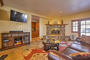 a living room with a couch and a fireplace at Mountaineer Manor in Glenwood Springs