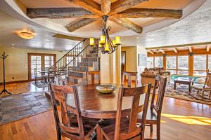 a dining room and living room with a table and chairs at Mountaineer Manor in Glenwood Springs