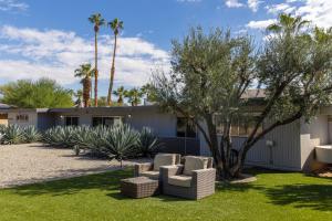 a house with two chairs in a yard at Designer Hideaway in Borrego Springs