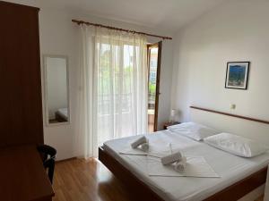 Posteľ alebo postele v izbe v ubytovaní Apartment Vesela 2
