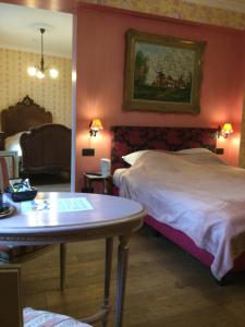 Postel nebo postele na pokoji v ubytování L'auberge hôtel Beauraing