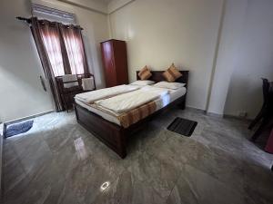 Postelja oz. postelje v sobi nastanitve N Joy Inn