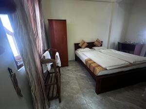 Postelja oz. postelje v sobi nastanitve N Joy Inn