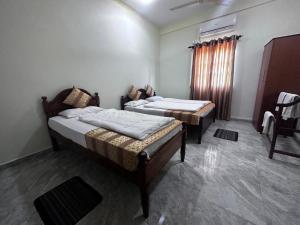 Postelja oz. postelje v sobi nastanitve N Joy Inn