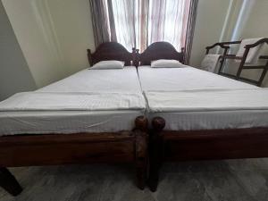 Postelja oz. postelje v sobi nastanitve N Joy Inn