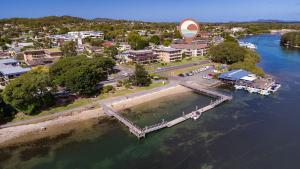 an aerial view of a city and a river with a hot air balloon at Camelot Unit 12 in Forster