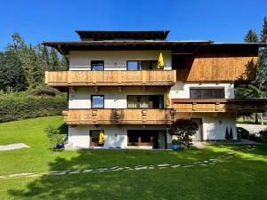 a large house with a large yard in front of it at W1 Haus Ganghofer in Leutasch +21 photos