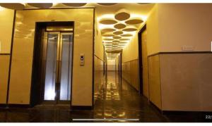 a hallway of a building with a hallwayngth at FabHotel Prime Anchorage in New Delhi