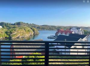 a view of a river with a boat in the water at Nautnes Seaside Villa in Nautnes