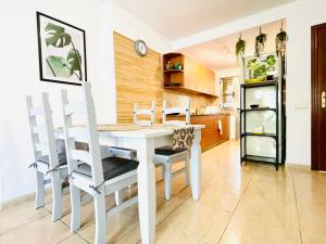 A kitchen or kitchenette at Rooftop Pool Apartment Corralejo