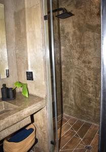 a bathroom with a sink and a shower at Moderno, cómodo y lindo departamento en Tijuana BC in Tijuana