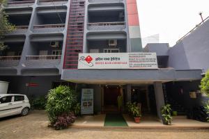 a building with a sign on the front of it at Hotel Rama Heritage in Nashik