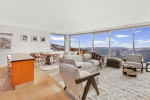 a living room with a couch and a table at MarkII 4 West in Mount Buller