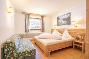Postel nebo postele na pokoji v ubytování Hotel Eschenhof & Apartments + 37 fotografií