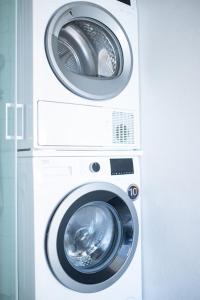 two washing machines stacked next to each other at Duplex Apartma Nikolina in Spodnje Jarše