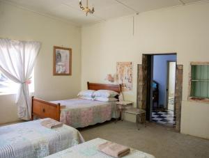 Ένα ή περισσότερα κρεβάτια σε δωμάτιο στο Willemsrivier Trekpad Guest Houses