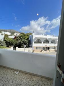 a balcony with a view of a building at Hotel Anezina in Drios