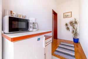Kuchyň nebo kuchyňský kout v ubytování Sweet triple room in Makarska + 11 fotografií