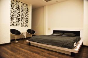 Thu Linh Villa tesisinde bir odada yatak veya yataklar