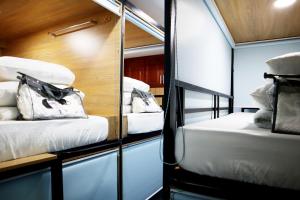 Postel nebo postele na pokoji v ubytování AMANGO HOSTEL