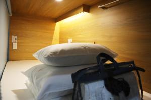 Postel nebo postele na pokoji v ubytování AMANGO HOSTEL