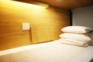 Postel nebo postele na pokoji v ubytování AMANGO HOSTEL