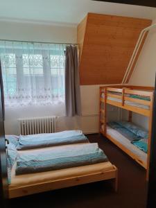 Postel nebo postele na pokoji v ubytování Ski park Gruň