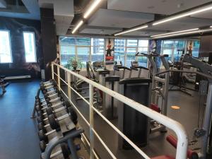 a gym with a bunch of treadmills and machines at White Sage - Gorgeous Apartment in JLT Near the Metro Station in Dubai