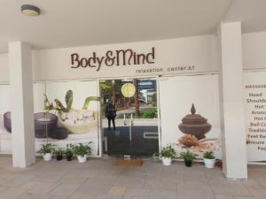 a store front of a body and mind fusion center art at White Sage - Gorgeous Apartment in JLT Near the Metro Station in Dubai
