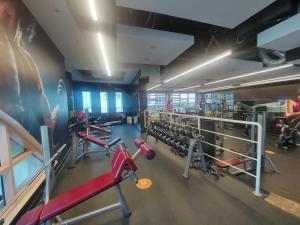 a gym with lots of equipment in a room at White Sage - Gorgeous Apartment in JLT Near the Metro Station in Dubai