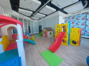 a play room with a bunch of play equipment at White Sage - Gorgeous Apartment in JLT Near the Metro Station in Dubai