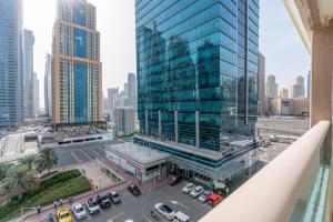 a view of a large glass building in a city at White Sage - Gorgeous Apartment in JLT Near the Metro Station in Dubai