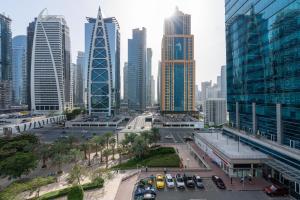 a city with tall buildings and cars in the street at White Sage - Gorgeous Apartment in JLT Near the Metro Station in Dubai