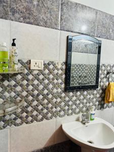 a bathroom with a sink and a mirror at Paridhi in Varanasi