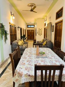 a dining room with a table and chairs at Paridhi in Varanasi