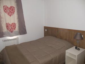 Postel nebo postele na pokoji v ubytování Apartamentos Grifo Vacances Grizzly