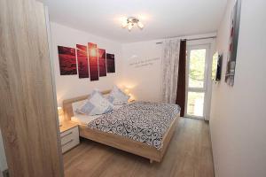 Postel nebo postele na pokoji v ubytování Villa Amelie _ App_ Seemoewe